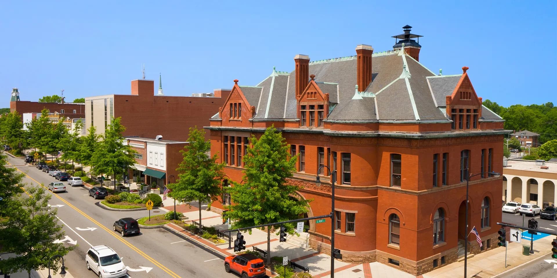 Historic downtown Statesville, NC with brick buildings and street view.