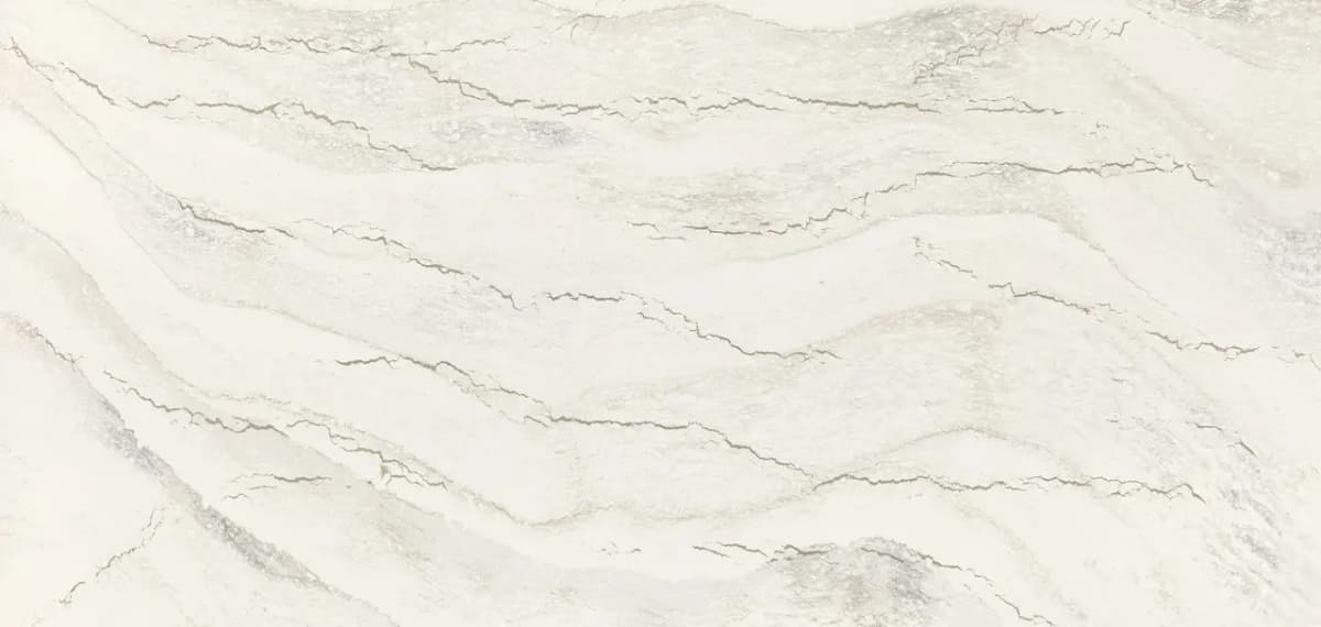 A balance of taupes, soft gray tones, and a crisp white background creates a captivating blend of warm and cool tones, complemented by delicate debossed Inverness™ veins.