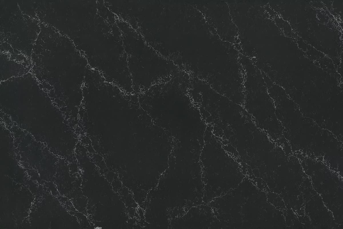 Black engineered quartz with gray/white veining 