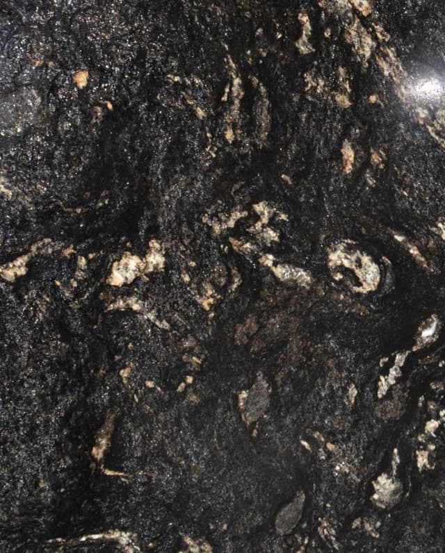 Black granite slab with gray, silver and gold swirl pattern