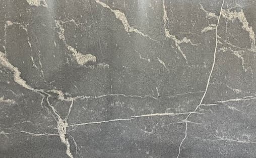 Gray granite with white and silver veined patterns.