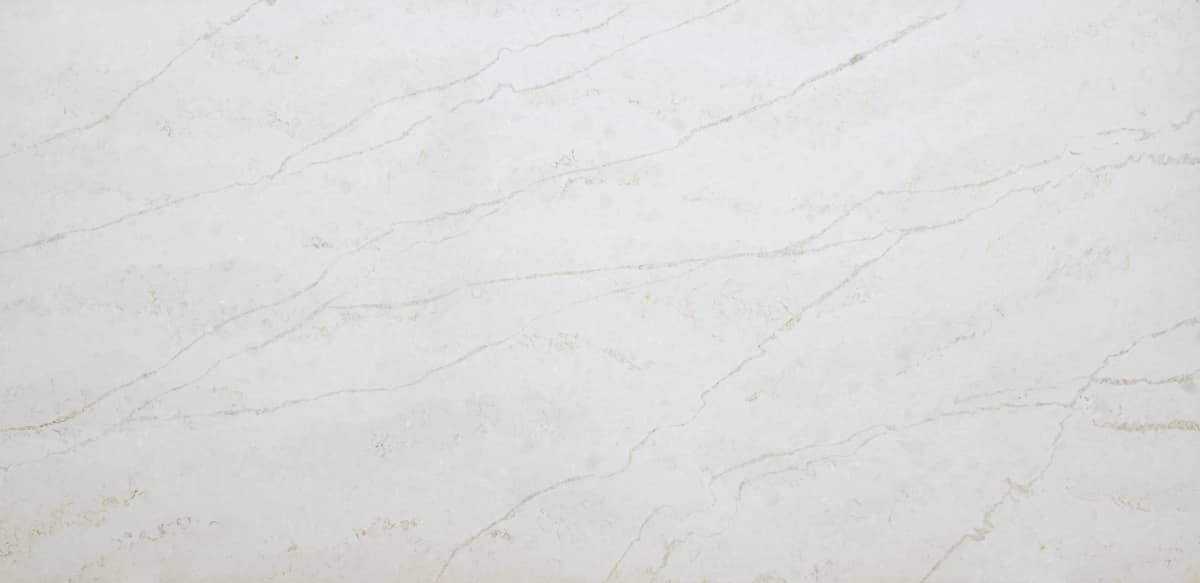 The Elara quartz slab embodies a harmonious fusion of celestial beauty in soft whites and silvery grey veins. Resembling the natural veining found in marble, these formations are distinct and a perfect compliment to several installation applications.