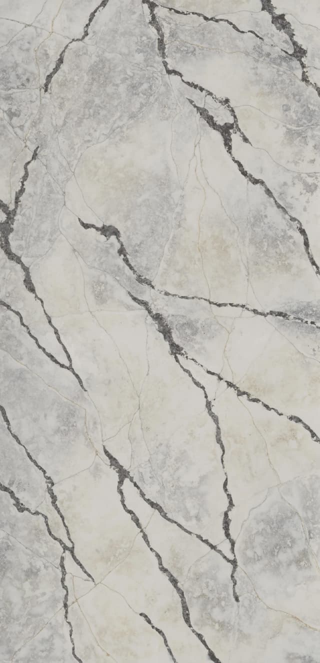 The Ijen Azul quartz slab resembles the shimmering iridescence that echoes the moonlit reflections on calm waters. Across the surface, delicate veins of azure and silver traverse with the elegance of mist, creating a sense of movement and depth.