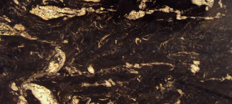 Black and brown granite with bold white swirls