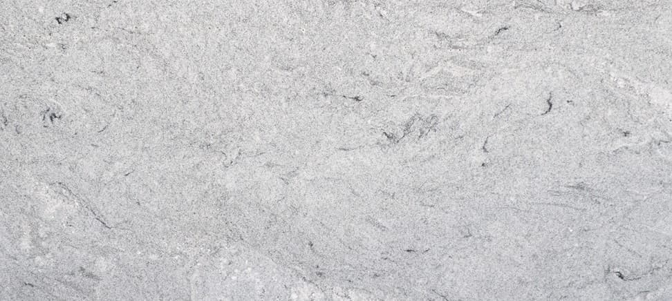 White granite with gray swirls and black specks.